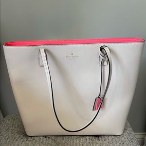 Cream Kate spade tote with pink interior.